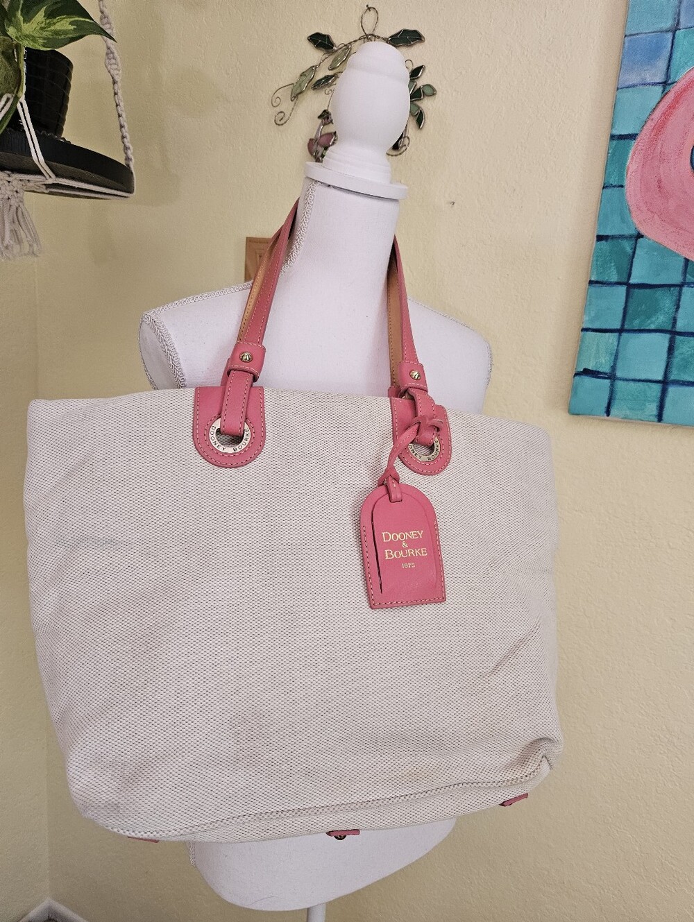 Dooney & Bourke Canvas Tote with Pink Leather Trim And removable top zipper.